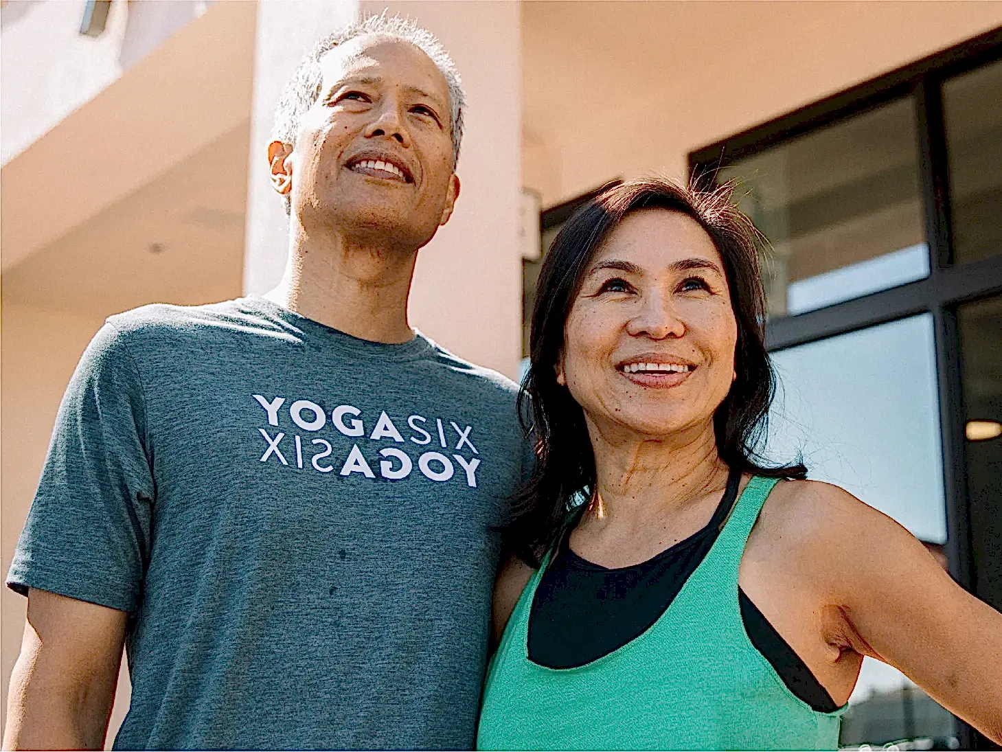 YogaSix participants looking up and smiling